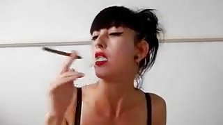 Pierced slut giving a cigar smoking blowjob