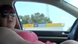 Obese skank wearing glasses rubs her twat in a car