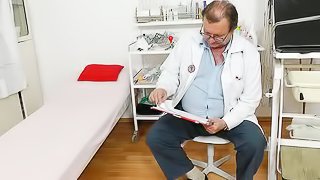Nasty blonde with a hairy pussy checks in a doctor's office